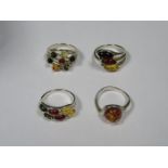 FOUR VARIOUS SILVER DRESS RINGS,