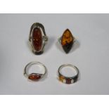 FOUR VARIOUS SILVER DRESS RINGS,