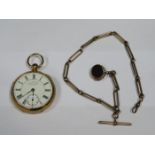 18ct GOLD POCKET WATCH (AT FAULT) WITH GOLD COLOURED ALBERT CHAIN AND 9ct GOLD ROTATING FOB