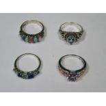 FOUR VARIOUS SILVER DRESS RINGS
