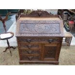 HEAVILY CARVED OAK JACOBEAN STYLE FALL FRONT OAK BUREAU