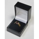 9ct GOLD LADIES DRESS RING SET WITH CENTRAL AMBER COLOURED STONE AND SMALL CITRINE AND CLEAR STONES
