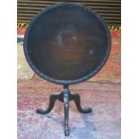 MAHOGANY CIRCULAR TILT TOP TABLE WITH CARVED DECORATION