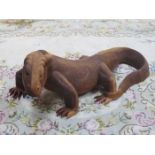 HEAVILY CARVED WOODEN FIGURE DEPICTING A KOMODO DRAGON,