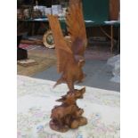 HEAVILY CARVED WOODEN FIGURE GROUP DEPICTING AN EAGLE AND FLEDGLING,