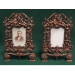 PAIR OF CAST METAL VICTORIAN STYLE PIERCEWORK DECORATED PHOTOGRAPH FRAMES.