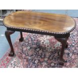 PIECRUST EDGED OVAL MAHOGANY COFFEE TABLE ON BALL AND CLAW SUPPORTS