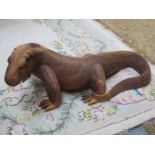 HEAVILY CARVED WOODEN FIGURE DEPICTING A KOMODO DRAGON,