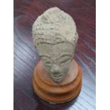 UNGLAZED INDIAN BUST ON WOODEN STAND