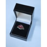 9ct GOLD DRESS RING SET WITH RUBY COLOURED STONE AND CLEAR STONES