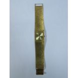 9ct GOLD BUECUE-DIROD WRISTWATCH ON 9ct GOLD STRAP