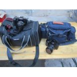 TWO MINOLTA CAMERAS WITH BAGS
