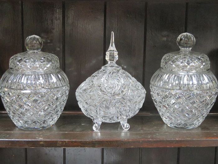 PAIR OF DECORATIVE GLASS SWEET JARS WITH COVERS AND ONE OTHER GLASS STORAGE JAR WITH COVER