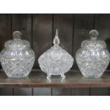 PAIR OF DECORATIVE GLASS SWEET JARS WITH COVERS AND ONE OTHER GLASS STORAGE JAR WITH COVER