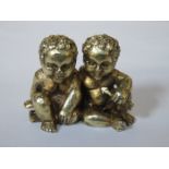 HALLMARKED SILVER GILT FIGURE GROUP DEPICTING TWO CHERUBS,