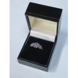 9ct GOLD DRESS RING SET WITH LILAC COLOURED STONES