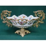 FLORAL DECORATED AND GILDED BRONPORN CERAMIC POST VASE ON GILT METAL SUPPORTS