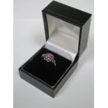 9ct GOLD DRESS RING SET WITH LILAC COLOURED STONES