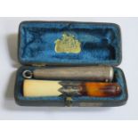 CASED SILVER CIGARETTE HOLDER AND SILVER BANDED,