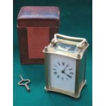 LEATHER CASED BRASS CARRIAGE CLOCK WITH KEY (AT FAULT)