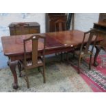 LARGE MAHOGANY WIND OUT TABLE WITH TWO LEAVES ON BALL AND CLAW SUPPORTS PLUS FOUR MAHOGANY DINING