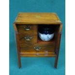BRASS INLAID SMOKER'S CABINET FITTED WITH THREE DRAWERS AND CERAMIC TOBACCO JAR