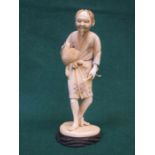 SECTIONAL IVORY FIGURE OF HUNTSMAN, SIGNED TO BASE,