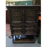 CARVED FRONTED OAK COCKTAIL CABINET