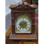 CARVED FRONTED WALNUT CASED BRACKET CLOCK WITH ORMOLU MOUNTED DIAL