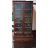 ANTIQUE MAHOGANY GEORGIAN STYLE TWO DOOR GLAZED BOOKCASE WITH CAMPAIGN STYLE BRASS HANDLES