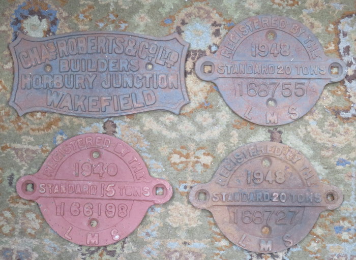 THREE LMS CAST IRON RAILWAY PLAQUES AND NON-RELATED CAST IRON PLAQUE