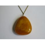 LARGE AMBER COLOURED PENDANT ON CHAIN