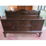 LARGE CARVED OAK SIDEBOARD