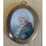 A framed portrait miniature Louis XVI, 5.5 x 4.5cm. oval, in brass case.