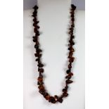 An amber necklace, L. 66cm.