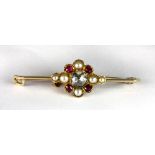 A Victorian 15ct gold bar brooch set with a centre old cut diamond (approx 0.5 ct) surrounded by