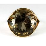 A 14ct gold ring set with a large topaz (N).