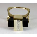 An unusual vintage 14ct yellow gold ring set with onyx and diamonds (O).