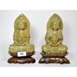 Two mid 20th C carved soapstone figures of the seated Buddha, H. 23cm.