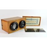 A stereo viewer and a box of stereo slides of Seville.