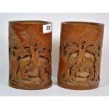 A pair of mid 20th century Chinese carved bamboo brush pots, H. 16.5cm.