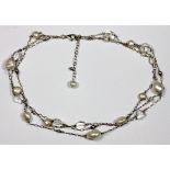 A silver cultured pearl and crystal necklace.