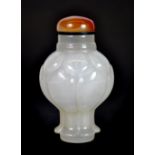 A superb Chinese carved chalcedony snuff bottle with agate stopper, H. 7cm.