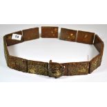 A Chinese carved brown/green jade sectional belt, L. 100cm.