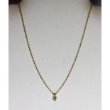 An 18ct gold solitaire diamond pendant and chain.