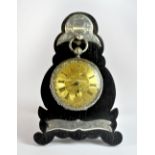 An antique white metal (tested silver) pocket watch and stand, H. 10cm.