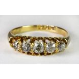 An antique 18ct yellow gold ring set with 5 diamonds (O.5).