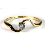 An 18ct gold diamond twist solitaire ring (P.5).