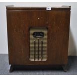 An early Decca record player in a wooden cabinet, W. 56cm, H. 61cm.