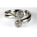 An 18ct white gold ring set with diamonds (N) (adjustable).